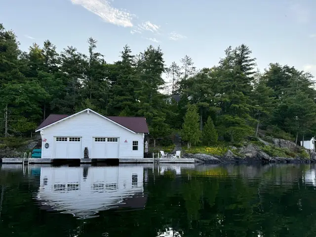 The boathouse at Sterling Point seen from Island K on Lake Joseph
